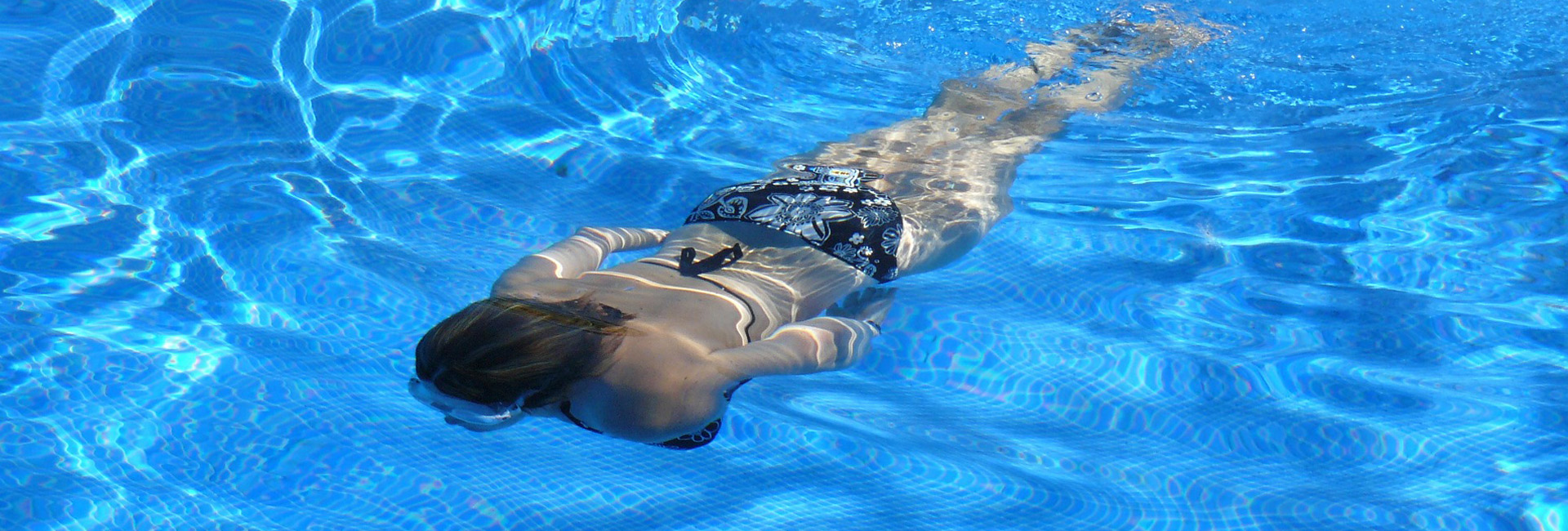 inground-swimming-pool-lady-swimming